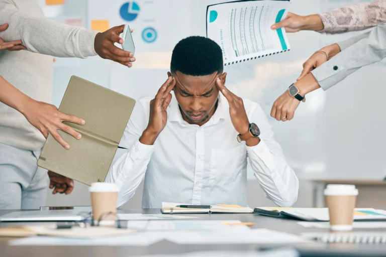 5 Practical Ways to Manage Stress at Work Employee practicing mindfulness at workplace Work stress management and burnout prevention Team leader supporting employee wellbeing